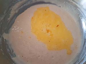 6. Add melted butter to the batter.