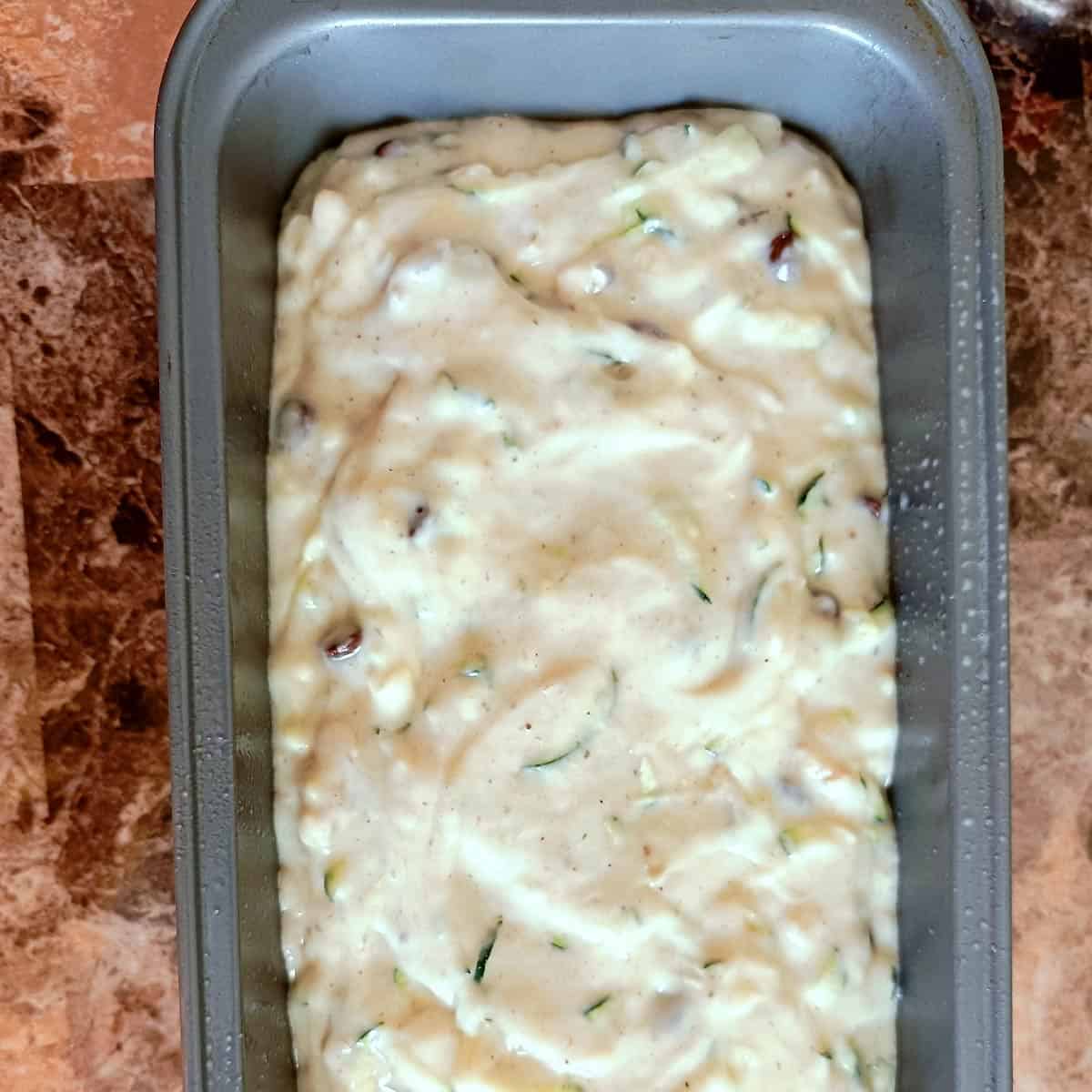 Pour the batter into bread pan