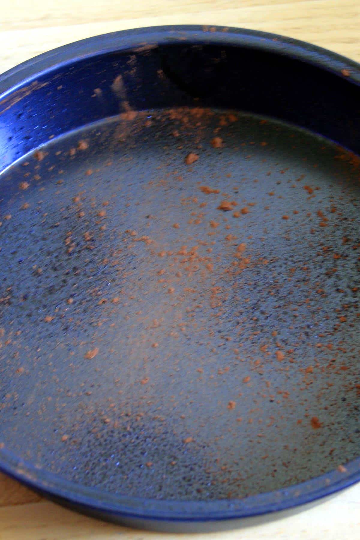 Sprinkle cocoa powder onto pan.