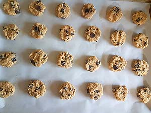 Scoop dough and flatten on the sheet.