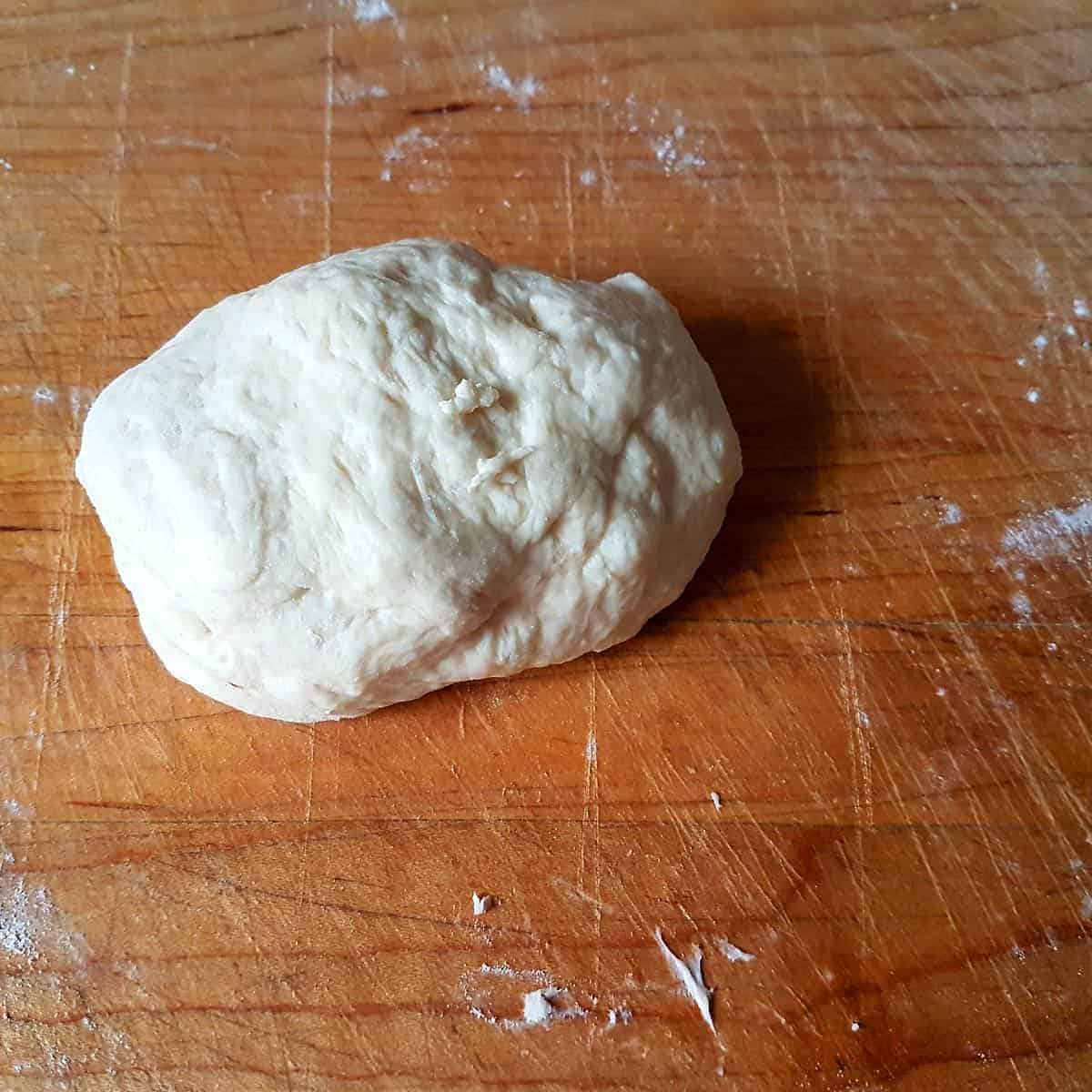 Take single dough ball