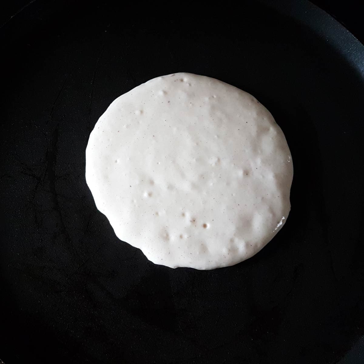 When the pan is hot enough, pour a ladleful of batter on the pan for each pancake.