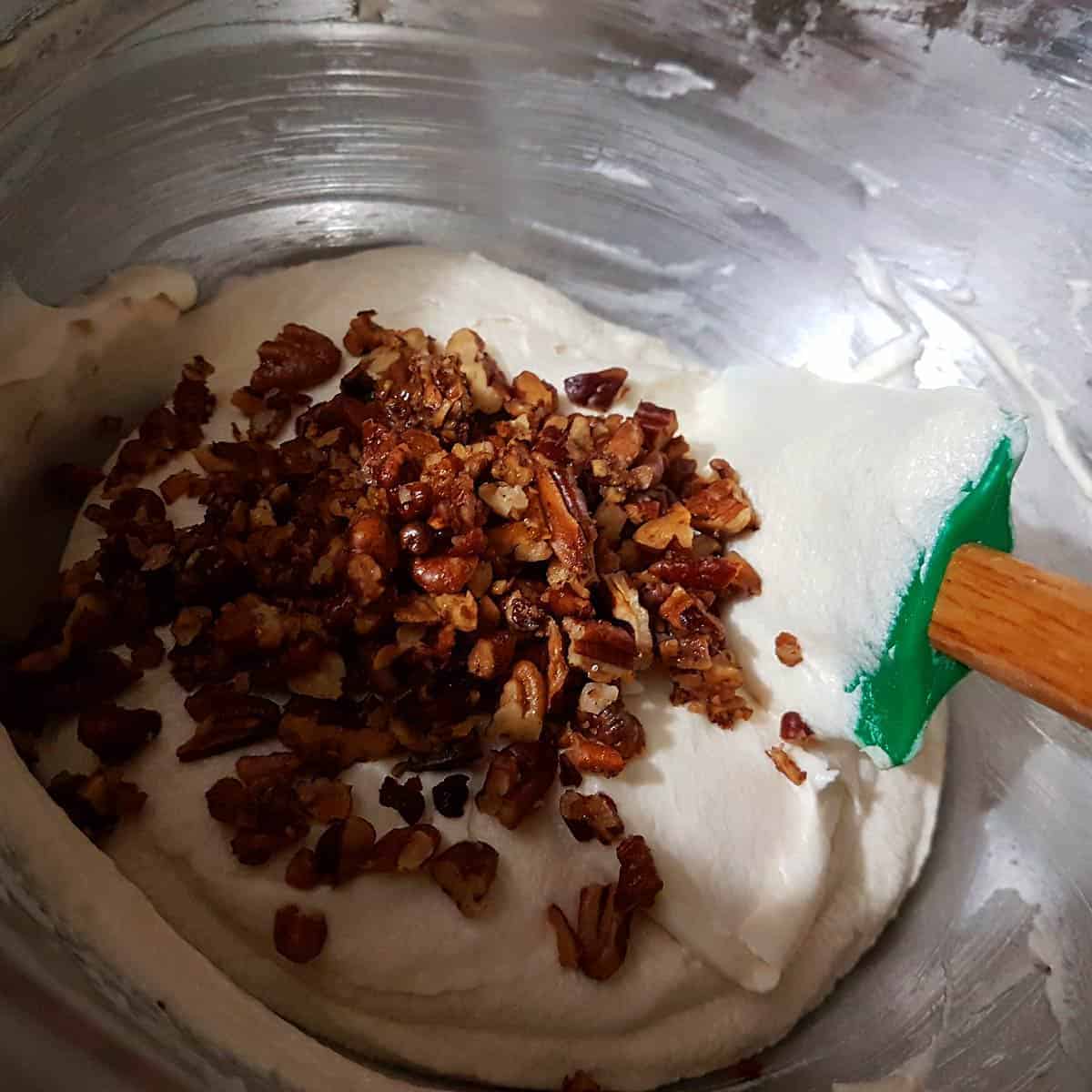 Add remaining toasted pecans